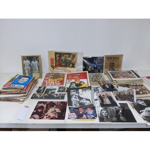 446 - A mixed lot of film, theatre and sporting memorabilia to include press photographs, lobby cards, the... 