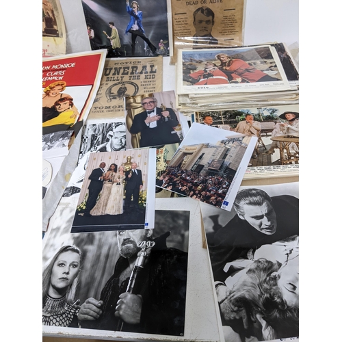 446 - A mixed lot of film, theatre and sporting memorabilia to include press photographs, lobby cards, the... 