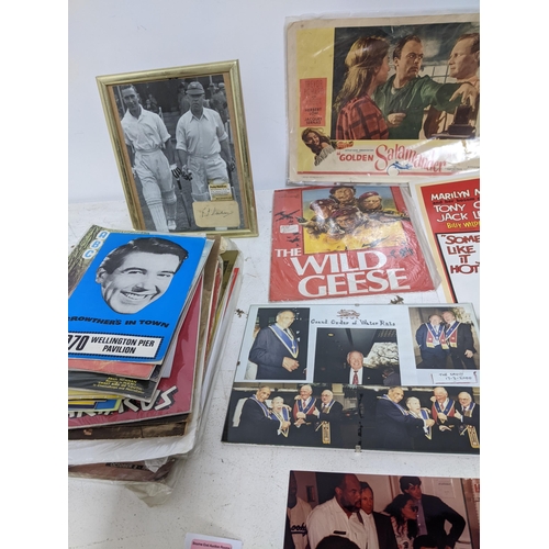 446 - A mixed lot of film, theatre and sporting memorabilia to include press photographs, lobby cards, the... 