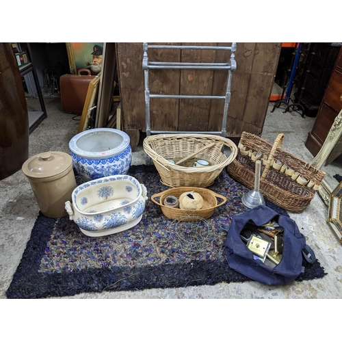 452 - A mixed lot of household items to include a vintage rag rug, 146c, x 100cm, a floral patterned foot ... 