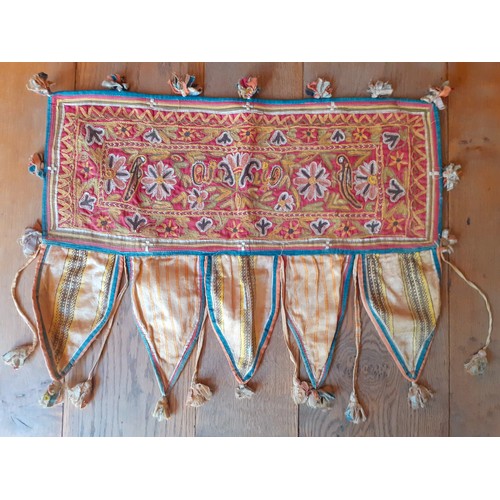 91 - A group of 5 mid 20th Century Indian hand-sewn window valances and Toran door hangings in various si... 