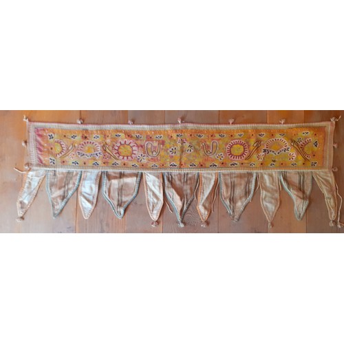 91 - A group of 5 mid 20th Century Indian hand-sewn window valances and Toran door hangings in various si... 