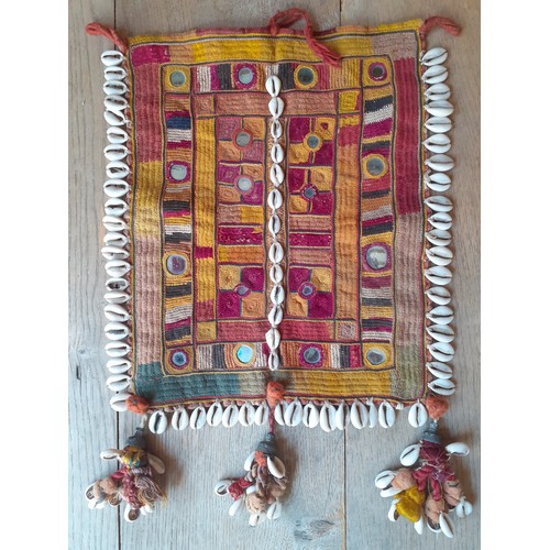 82 - A group of vintage Indian Banjara handmade and other textiles to include panels, 3 Banjara purses an... 