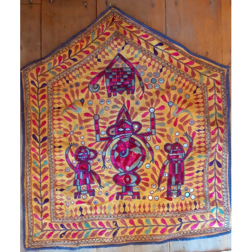 116 - A quantity of mainly mid 20th Century Indian hand embroidered textiles and clothing segments to incl... 