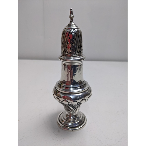 198 - An Edwardian silver sugar caster, Birmingham 1905, with a pierced top and gadrooned decoration, 19cm... 