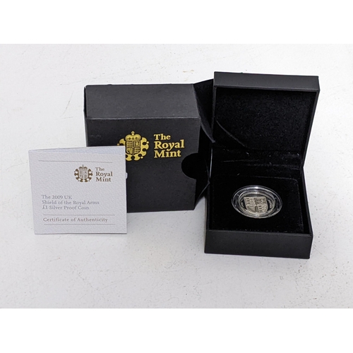 245 - A The Royal Mint £1 silver proof coin with a shield to the obverse, boxed with paperwork

Location: ... 