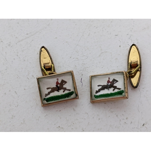 32 - A pair of vintage plated cufflinks, each panel decorated with a person on horseback. Location: CAB 5... 