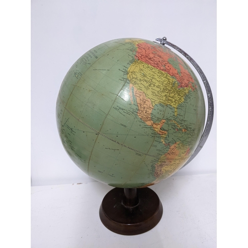 76 - A mid 20th century Philips' Challenge Globe, on a wooden stand, 46cm high. Location: 2-2. 

Location... 