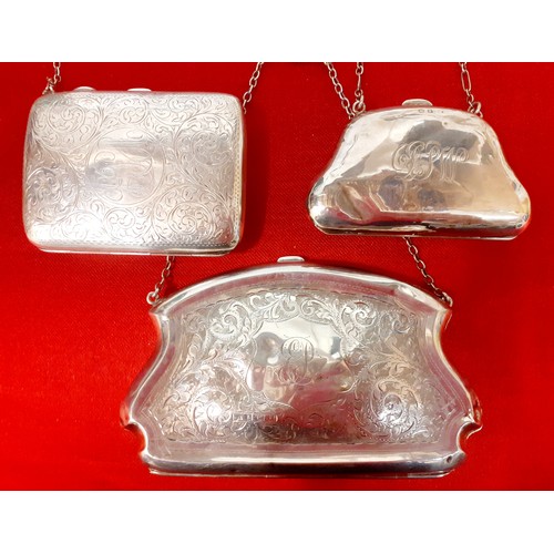 30 - Three early 20th Century silver purses with white metal chain handles A/F, the larger engraved and m... 