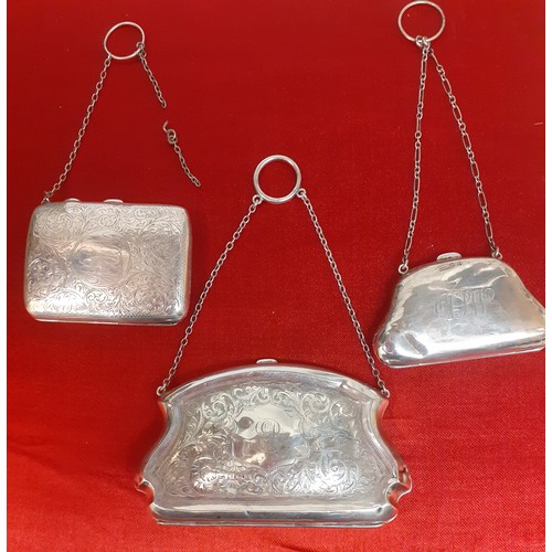 30 - Three early 20th Century silver purses with white metal chain handles A/F, the larger engraved and m... 