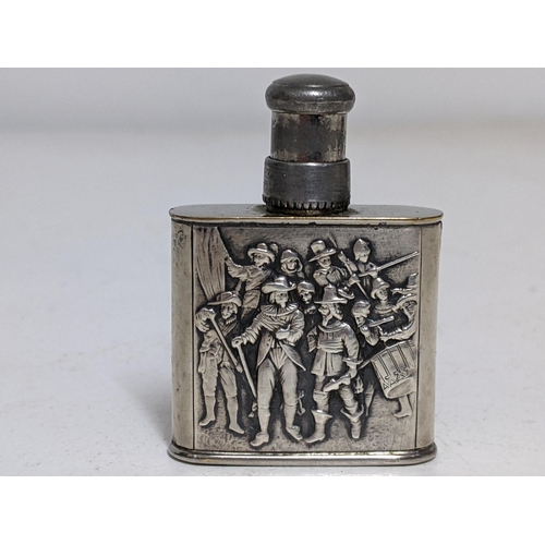 184 - A Continental silver and silver plated perfume atomiser, embossed with a Dutch Army to the front and... 