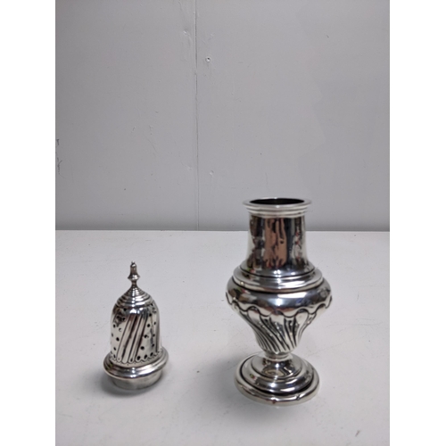 198 - An Edwardian silver sugar caster, Birmingham 1905, with a pierced top and gadrooned decoration, 19cm... 