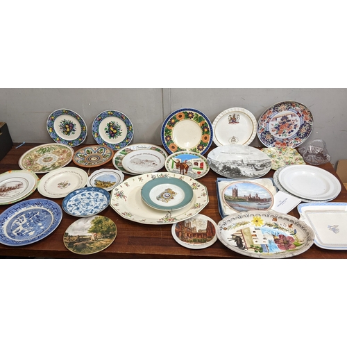 29 - A collection of commemorative and souvenir plates to include a Denham village example, a Wedgwood 'M... 