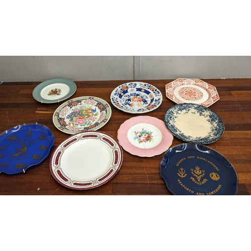 29 - A collection of commemorative and souvenir plates to include a Denham village example, a Wedgwood 'M... 