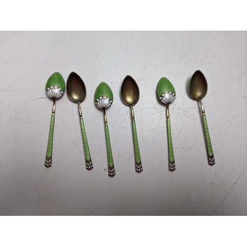 96 - A set of six silver gilt and enamel coffee spoons with import marks 925, dated 1926, decorated with ... 