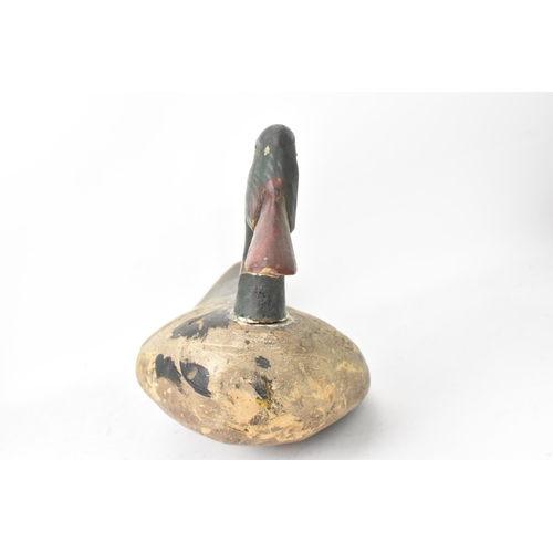 294 - A vintage carved and hand painted wooden duck decoy, 25cm high x 55cm wide
Location: 7-3
If there is... 