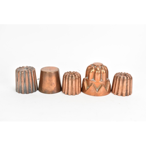 106 - A selection of 19th century copper moulds to include one of circular gadrooned form, another of cast... 