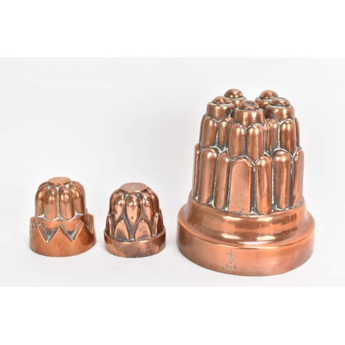 106 - A selection of 19th century copper moulds to include one of circular gadrooned form, another of cast... 