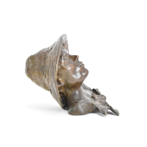 111 - An early 20th century bronze head sculpture, depicting a boy wearing a hat, 11.5cm high x 13cm wide
... 