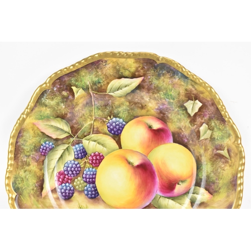 115 - A Royal Worcester fruit decorated cabinet plate, of shaped circular form, hand painted with still li... 