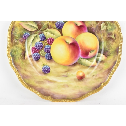 115 - A Royal Worcester fruit decorated cabinet plate, of shaped circular form, hand painted with still li... 