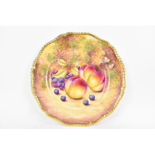 116 - A Royal Worcester fruit decorated cabinet plate, of shaped circular form, hand painted with still li... 