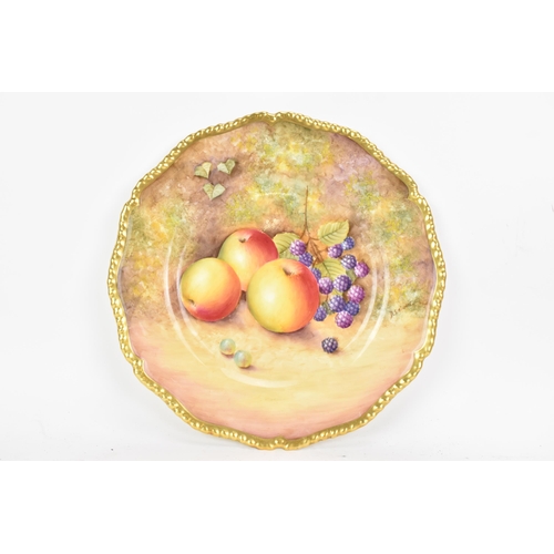 117 - A Royal Worcester fruit decorated cabinet plate, of shaped circular form, hand painted with still li... 