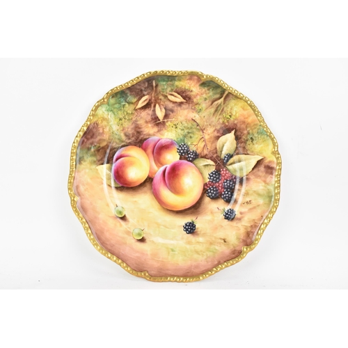 118 - A Royal Worcester fruit decorated cabinet plate, of shaped circular form, hand painted with still li... 