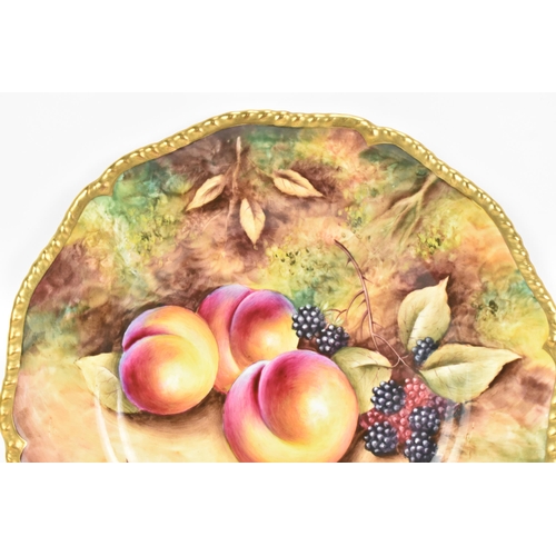 118 - A Royal Worcester fruit decorated cabinet plate, of shaped circular form, hand painted with still li... 