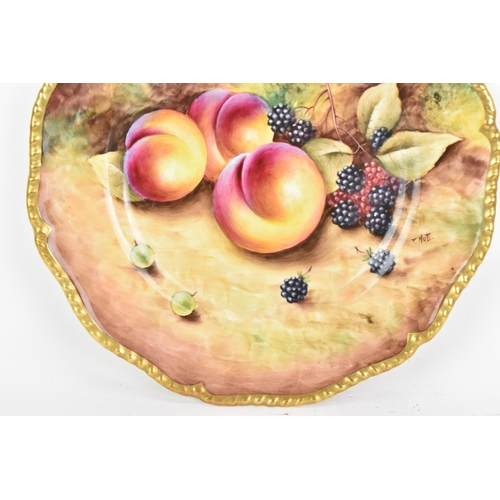 118 - A Royal Worcester fruit decorated cabinet plate, of shaped circular form, hand painted with still li... 