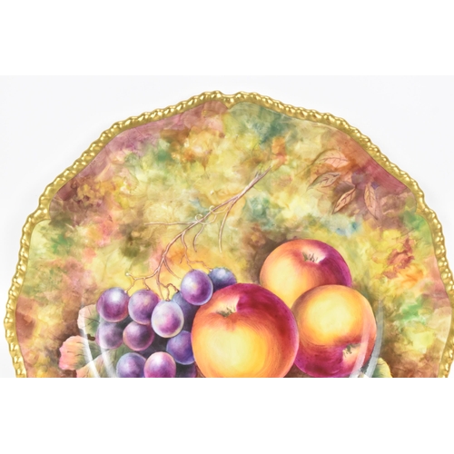 119 - A Royal Worcester fruit decorated cabinet plate, of shaped circular form, hand painted with still li... 