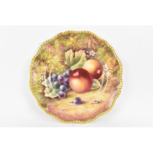 120 - A Royal Worcester fruit decorated cabinet plate, of shaped circular form, hand painted with still li... 