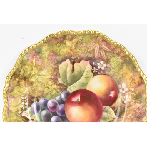 120 - A Royal Worcester fruit decorated cabinet plate, of shaped circular form, hand painted with still li... 