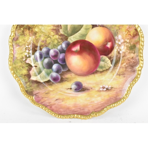 120 - A Royal Worcester fruit decorated cabinet plate, of shaped circular form, hand painted with still li... 