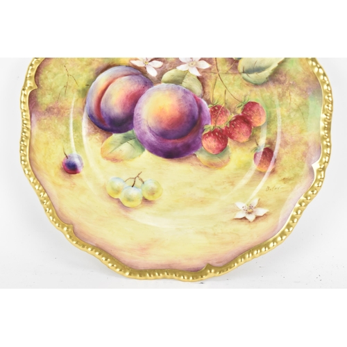 121 - A Royal Worcester fruit decorated cabinet plate, of shaped circular form, hand painted with still li... 