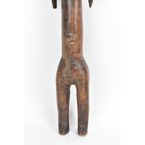 124 - Ethnographic Tribal Art - An African tribal carving of a female fertility figure, of standing form a... 