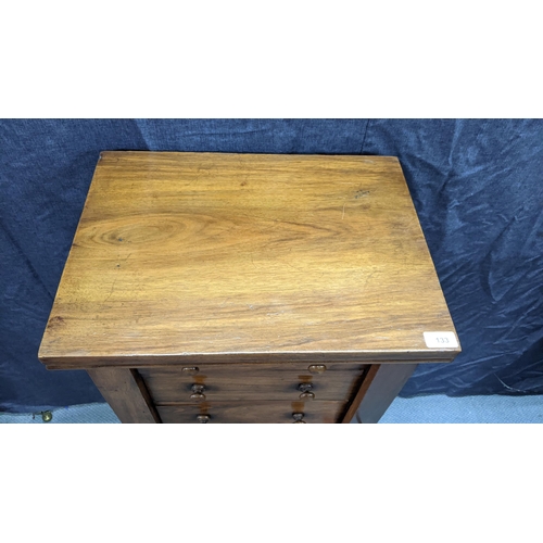 133 - A Victorian walnut wellington chest, having six graduated drawers with bun shaped handles, two side ... 