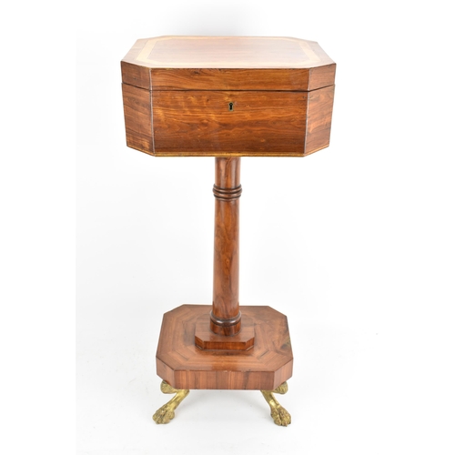 135 - A Regency rosewood teapoy, the octagonal top having satinwood inlaid banding, a two canister fitted ... 