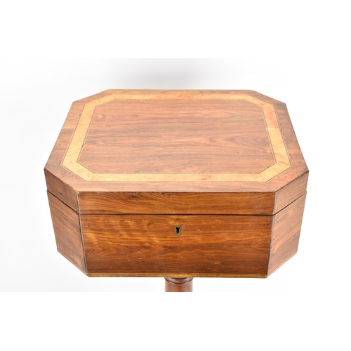 135 - A Regency rosewood teapoy, the octagonal top having satinwood inlaid banding, a two canister fitted ... 