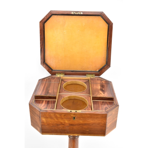 135 - A Regency rosewood teapoy, the octagonal top having satinwood inlaid banding, a two canister fitted ... 