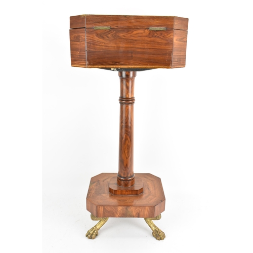 135 - A Regency rosewood teapoy, the octagonal top having satinwood inlaid banding, a two canister fitted ... 