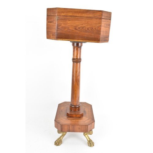 135 - A Regency rosewood teapoy, the octagonal top having satinwood inlaid banding, a two canister fitted ... 