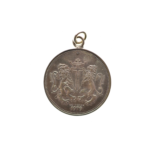 161 - A 9ct gold pendant in the style of a sovereign, dated 1979 and hallmarked 375, 3.4 grams
If there is... 