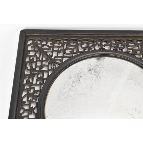 18 - A 19th Chinese cloisonne panel and mirror, housed in an ebonised pierced frame with, the panel havin... 