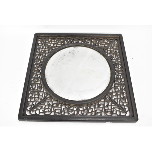 18 - A 19th Chinese cloisonne panel and mirror, housed in an ebonised pierced frame with, the panel havin... 