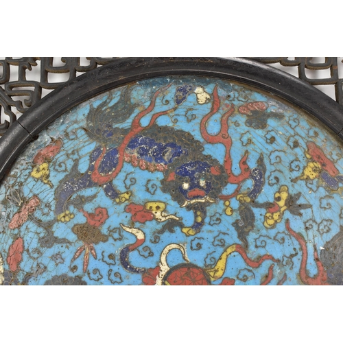 18 - A 19th Chinese cloisonne panel and mirror, housed in an ebonised pierced frame with, the panel havin... 