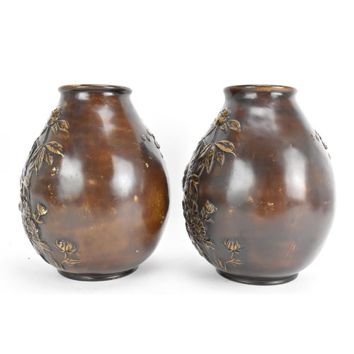 19 - A pair of early 20th century Japanese bronze vases, each of ovoid form and cast relief decoration de... 