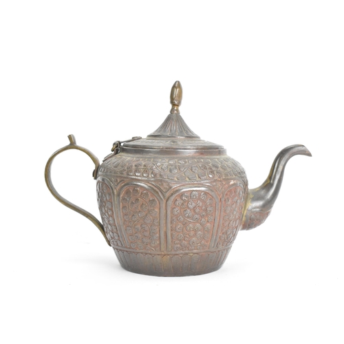 21 - A 19th century Indian Kashmiri copper teapot, profusely decorated with incised and embossed floral d... 