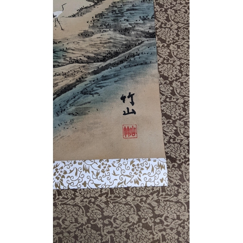 24 - Three 20th century Chinese scroll paintings to include one depicting cranes in a mountain landscape ... 