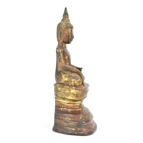 26 - A 18th/19th Century Bronze Buddha, modelled seated in varada mudra on a lotus throne, 19cm x 8.5cm w... 